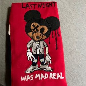 This is a sweater with an image of ink  Mickey